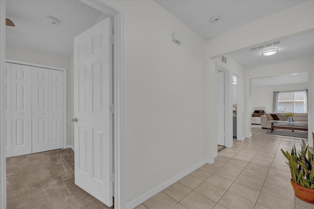 hallway with light tile patterned floors