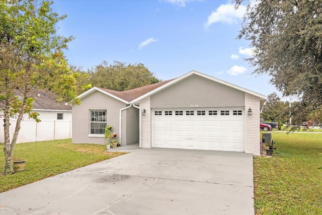 ranch-style home featuring a front yard and a garage