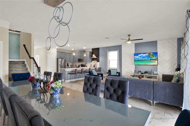 dining space featuring ceiling fan