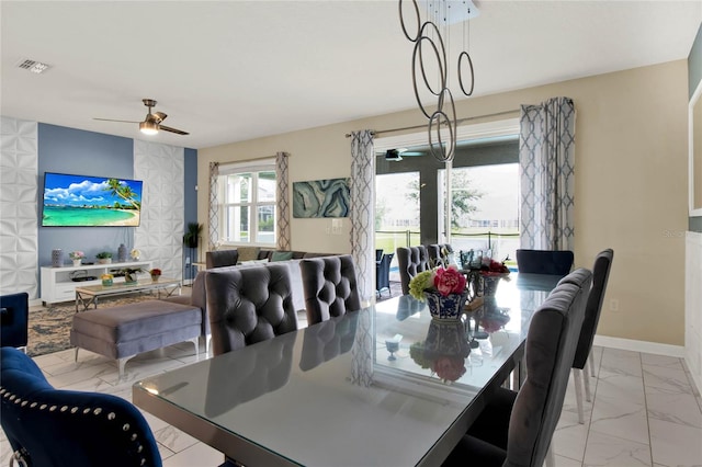 dining space with ceiling fan