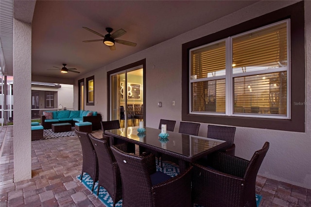 view of patio / terrace with an outdoor living space and ceiling fan