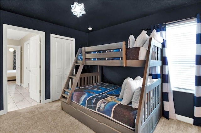 carpeted bedroom with a closet