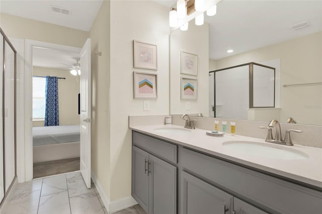 bathroom with ceiling fan, vanity, and an enclosed shower