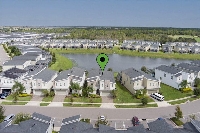 birds eye view of property featuring a water view