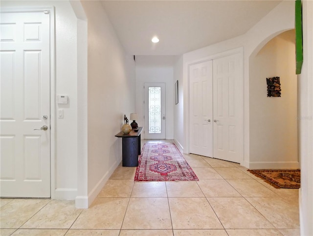 entryway featuring light tile patterned floors