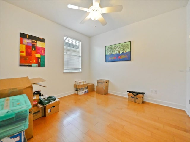 misc room with wood-type flooring and ceiling fan