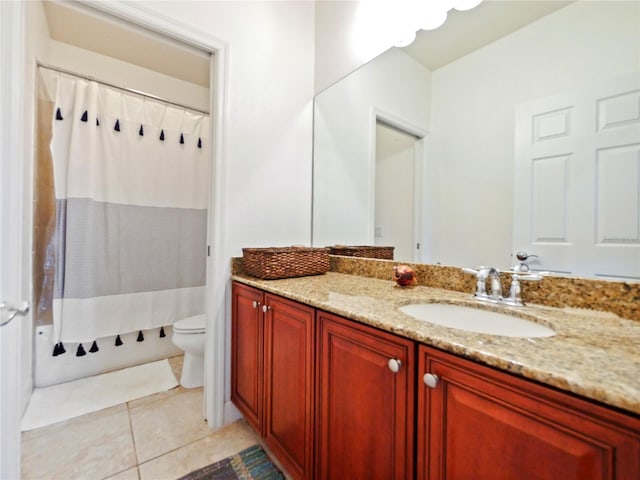 bathroom featuring a shower with shower curtain, tile patterned floors, vanity, and toilet