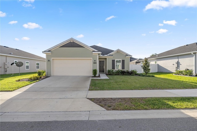 ranch-style house featuring a front lawn and a garage