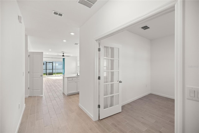 hallway featuring light hardwood / wood-style flooring