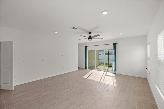 empty room with ceiling fan and light wood-type flooring