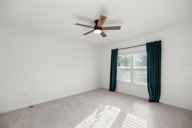 empty room with light carpet and ceiling fan