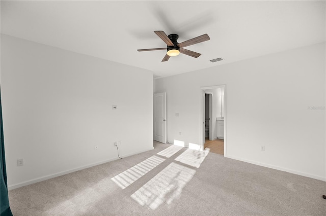 unfurnished room with light carpet and ceiling fan