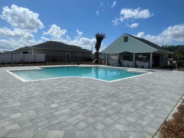 view of pool featuring a patio area, fence, and a fenced in pool