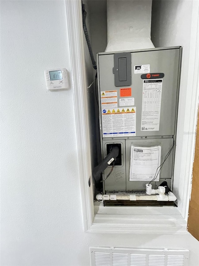 utility room with heating unit