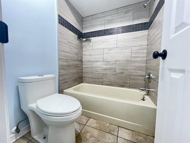 bathroom with toilet and tiled shower / bath combo