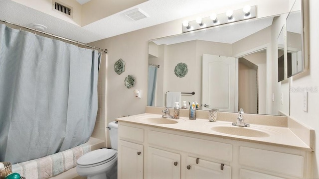 full bathroom featuring shower / tub combo, vanity, and toilet