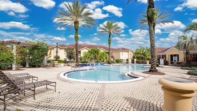 view of swimming pool with a patio