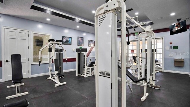 gym with a textured ceiling