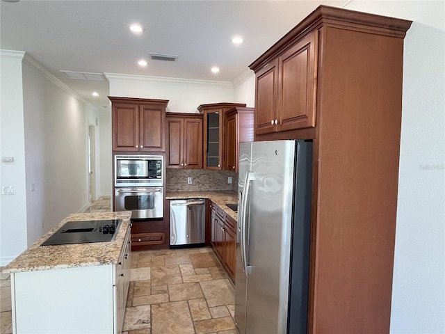 kitchen featuring light stone counters, tasteful backsplash, a kitchen island, appliances with stainless steel finishes, and crown molding