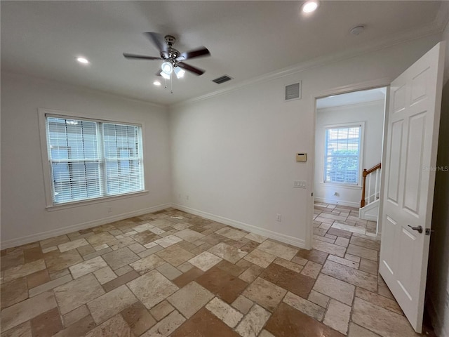 spare room featuring ceiling fan and crown molding