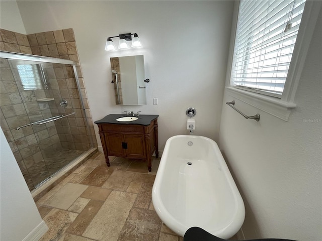 bathroom with vanity and separate shower and tub