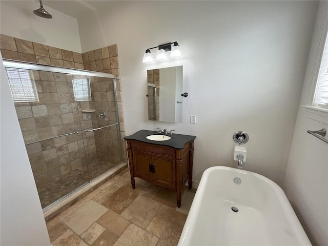 bathroom with independent shower and bath and vanity