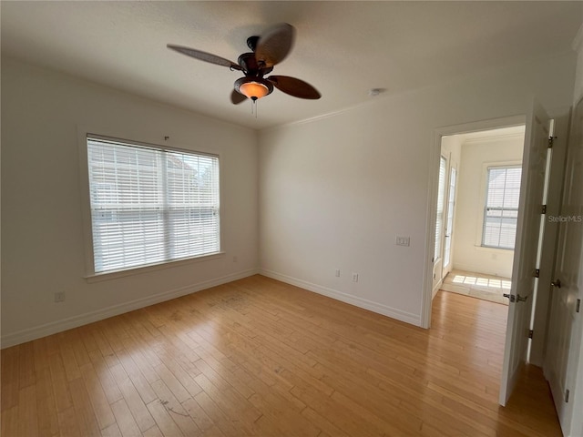 unfurnished room with ceiling fan and light hardwood / wood-style flooring