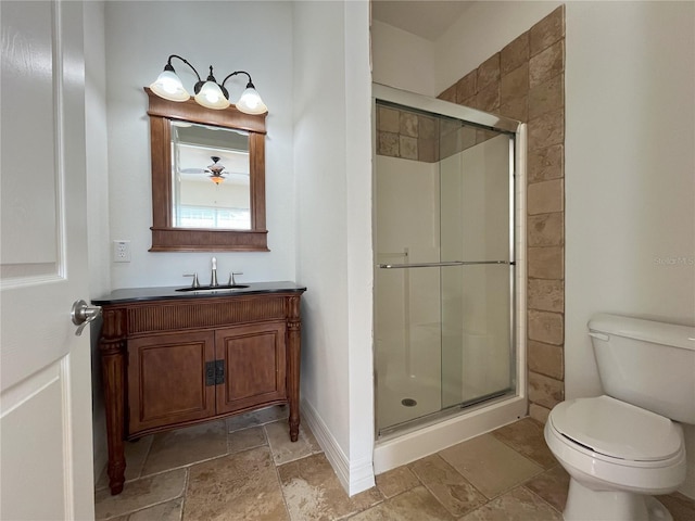 bathroom with vanity, toilet, and an enclosed shower