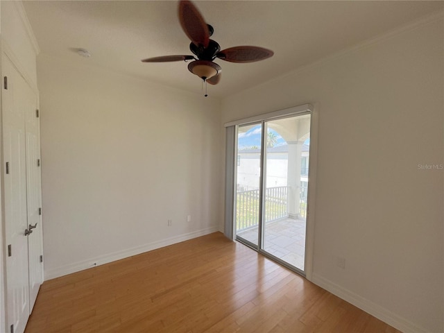 spare room with ceiling fan, ornamental molding, and light hardwood / wood-style floors