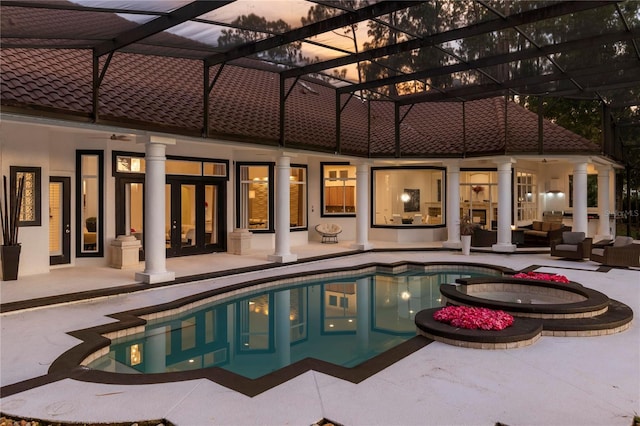 view of swimming pool with a lanai, an outdoor hangout area, and a patio