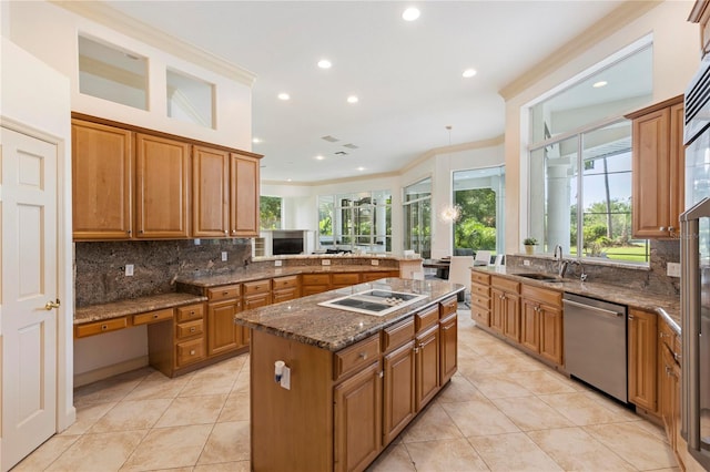 kitchen with sink, tasteful backsplash, a kitchen island, dishwasher, and crown molding