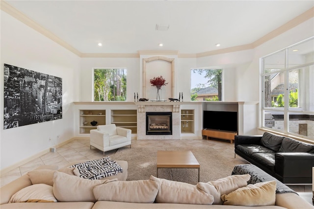 tiled living room with a premium fireplace, crown molding, and a wealth of natural light