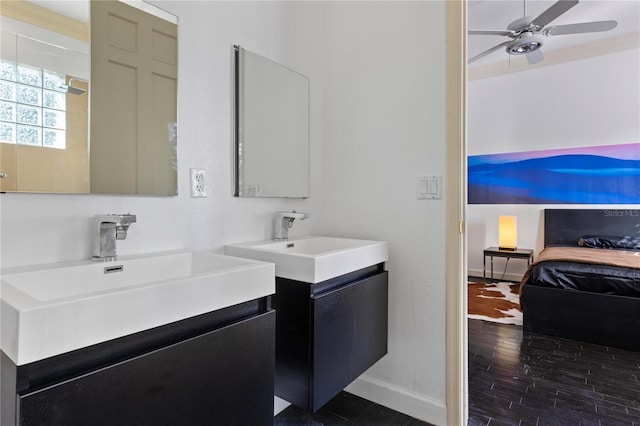 bathroom featuring vanity, hardwood / wood-style flooring, and ceiling fan