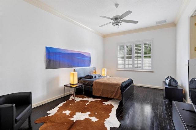 bedroom featuring ceiling fan, crown molding, and dark hardwood / wood-style flooring