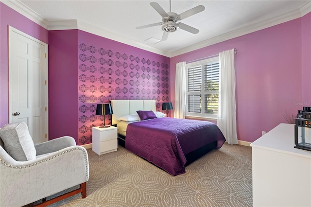 carpeted bedroom with crown molding and ceiling fan