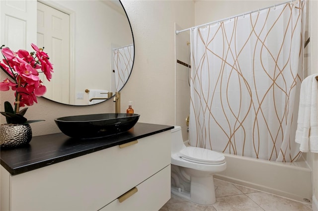 full bathroom featuring shower / bath combo, vanity, toilet, and tile patterned floors