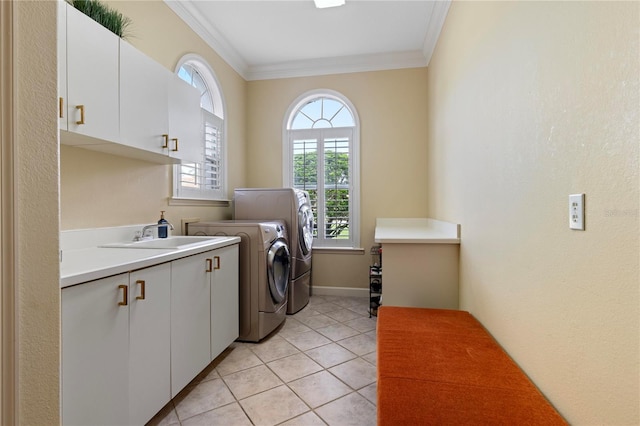 laundry room featuring cabinets, sink, light tile patterned floors, separate washer and dryer, and ornamental molding