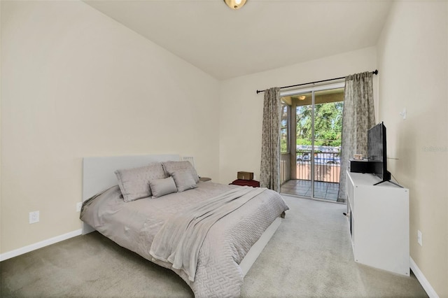 carpeted bedroom featuring access to outside