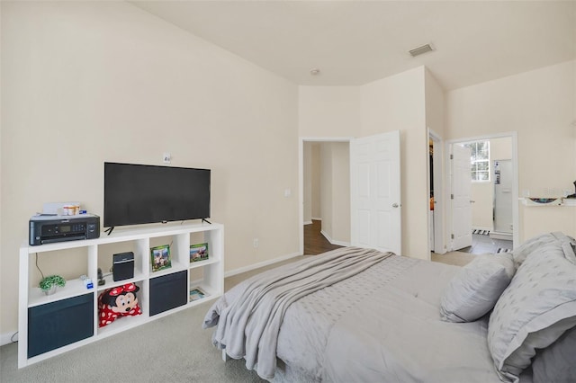 bedroom with light colored carpet