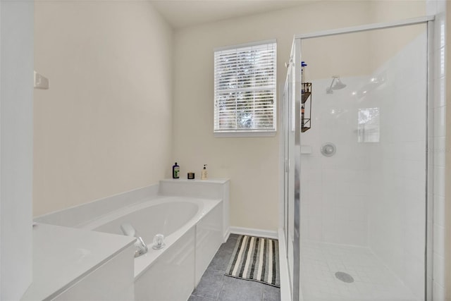 bathroom featuring independent shower and bath and tile patterned flooring