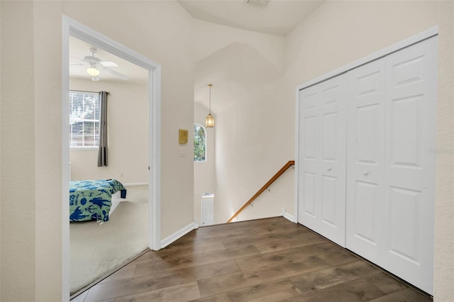 hall with dark hardwood / wood-style flooring