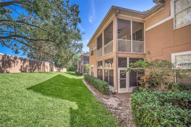 view of yard featuring a sunroom