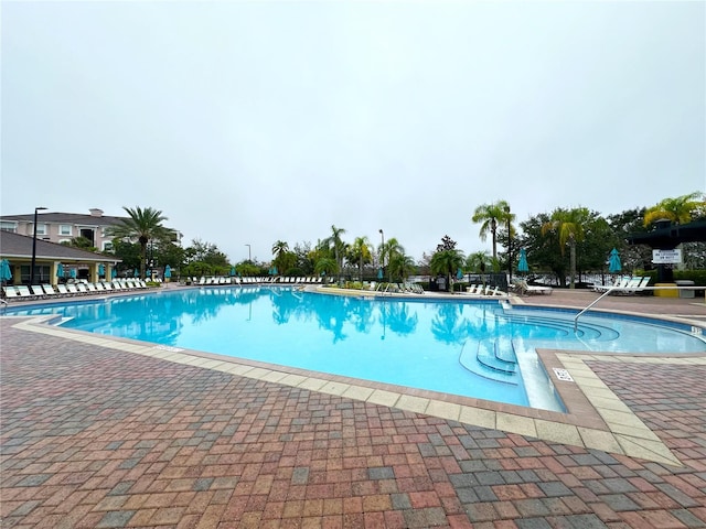 community pool featuring a patio area