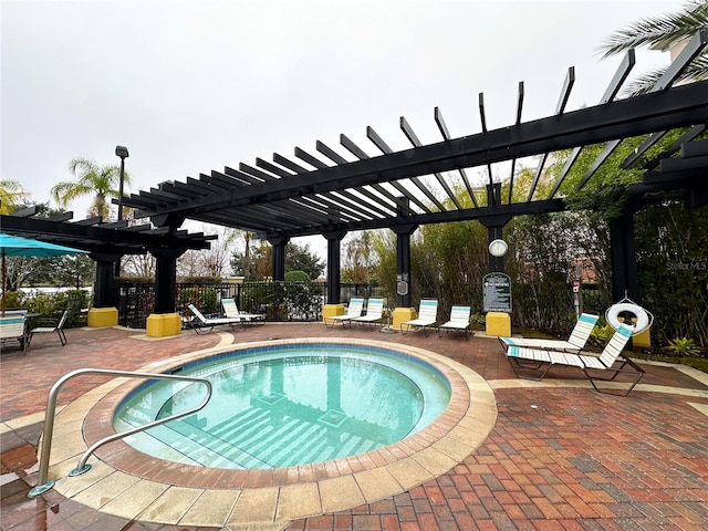 view of swimming pool with a pergola and a patio