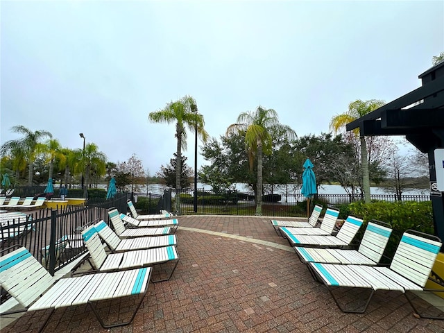 surrounding community with a patio and fence