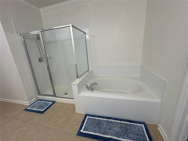 full bath featuring tile patterned flooring, a stall shower, a garden tub, and ornamental molding