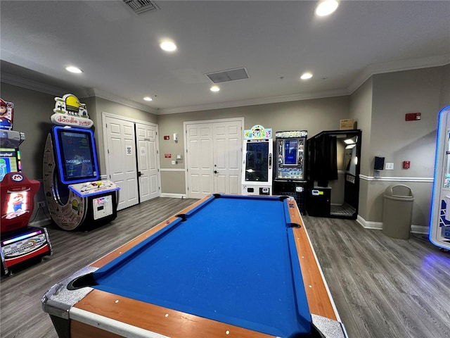 game room featuring visible vents, wood finished floors, and crown molding