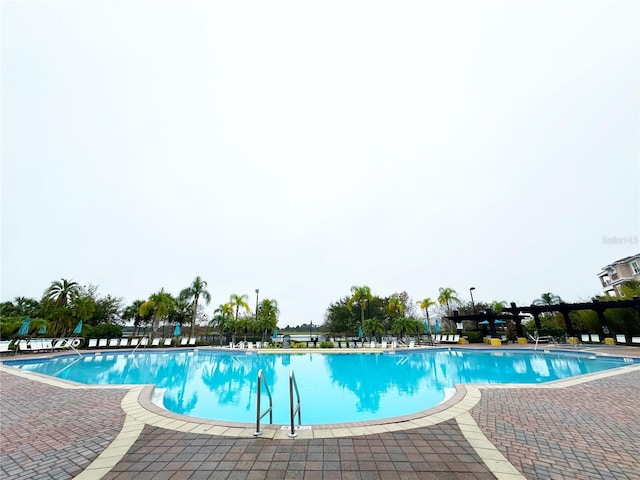 community pool with a patio area