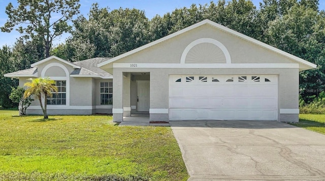 single story home with a garage and a front yard