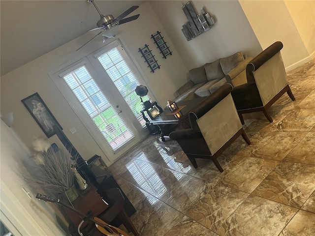 living room featuring ceiling fan, french doors, and a wealth of natural light